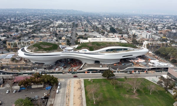 An aerial view shows the sneaker-shaped Lucas Museum under construction in Exposition Park.