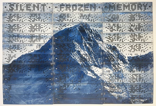 A painting on vintage computer punchcards reveals a snowy Andean peak rendered in monochromatic shades of blue and white. Above it are three words in all capital letters: SILENT, FROZEN, MEMORY.