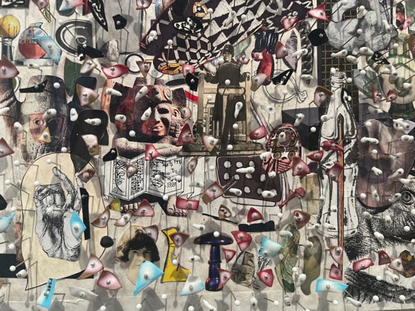 A detail of a painting by Elliott Hundley shows images and others bit of material pinned onto the surface of a panel covered in a collage of images that includes a Mesoamerican sculpture, a drawing of a hand and a print of a Coke bottle.