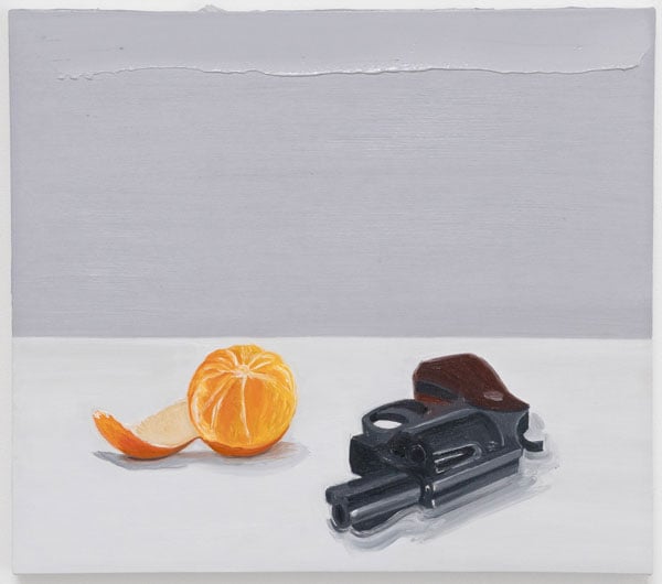 A still life painting by Salomón Huerta shows a partly peeled orange sitting next to a gun against neutral backdrops of white and grey.