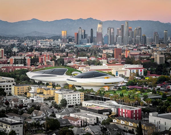 A view of the Lucas museum from the southwest shows downtown Los Angeles and the San Gabriel Mountains behind a spaceship building.