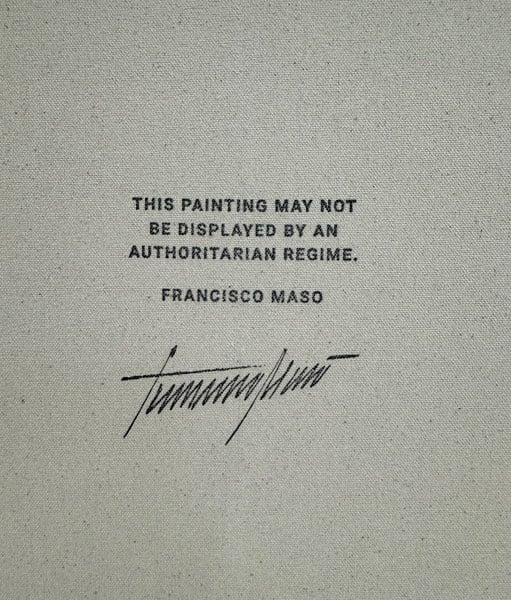 The back of a canvas reads, "THIS PAINTING MAY NOT BE DISPLAYED BY AN AUTHORITARIAN REGIME."