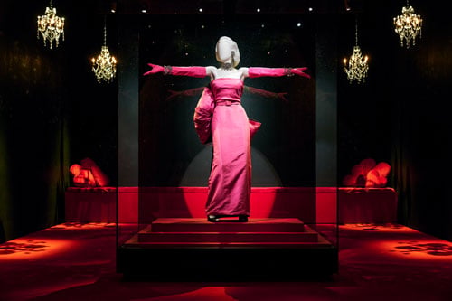 A museum installation shows a mannequin styled like Marilyn Monroe in the famous pink dress she wore in "Diamonds Are a Girl's Best Friend."