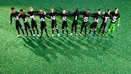 A series of handbuilt figurines eveoke the German national team wearing jerseys that together spell out "Human Rights"