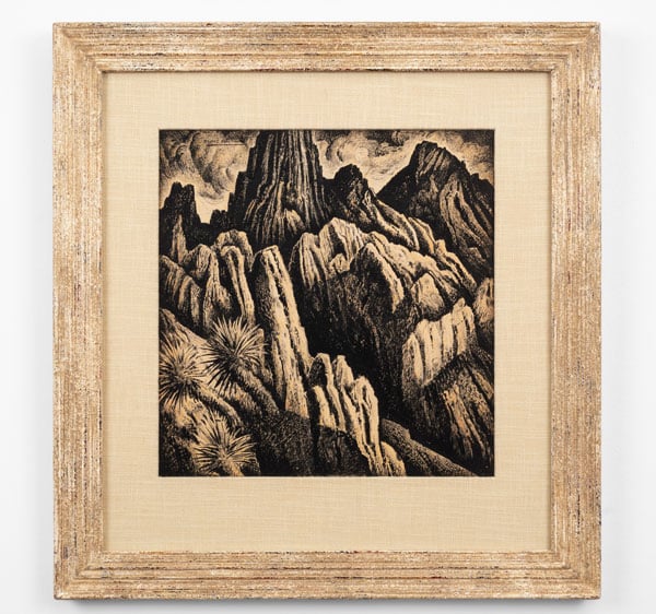 A monochromatic watercolor by Alfredo Ramos Martinez shows a rocky landscape with spiky succulents in the foreground.