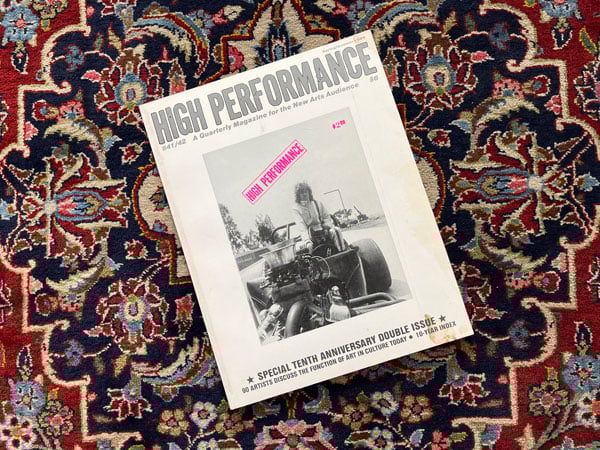 A photo of the 10th anniversary issue of High Performance magazine, featuring a woman on a tractor.