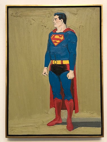 A painting by California artist Mel Ramos shows a thoughtful looking Superman before a putty-colored background.