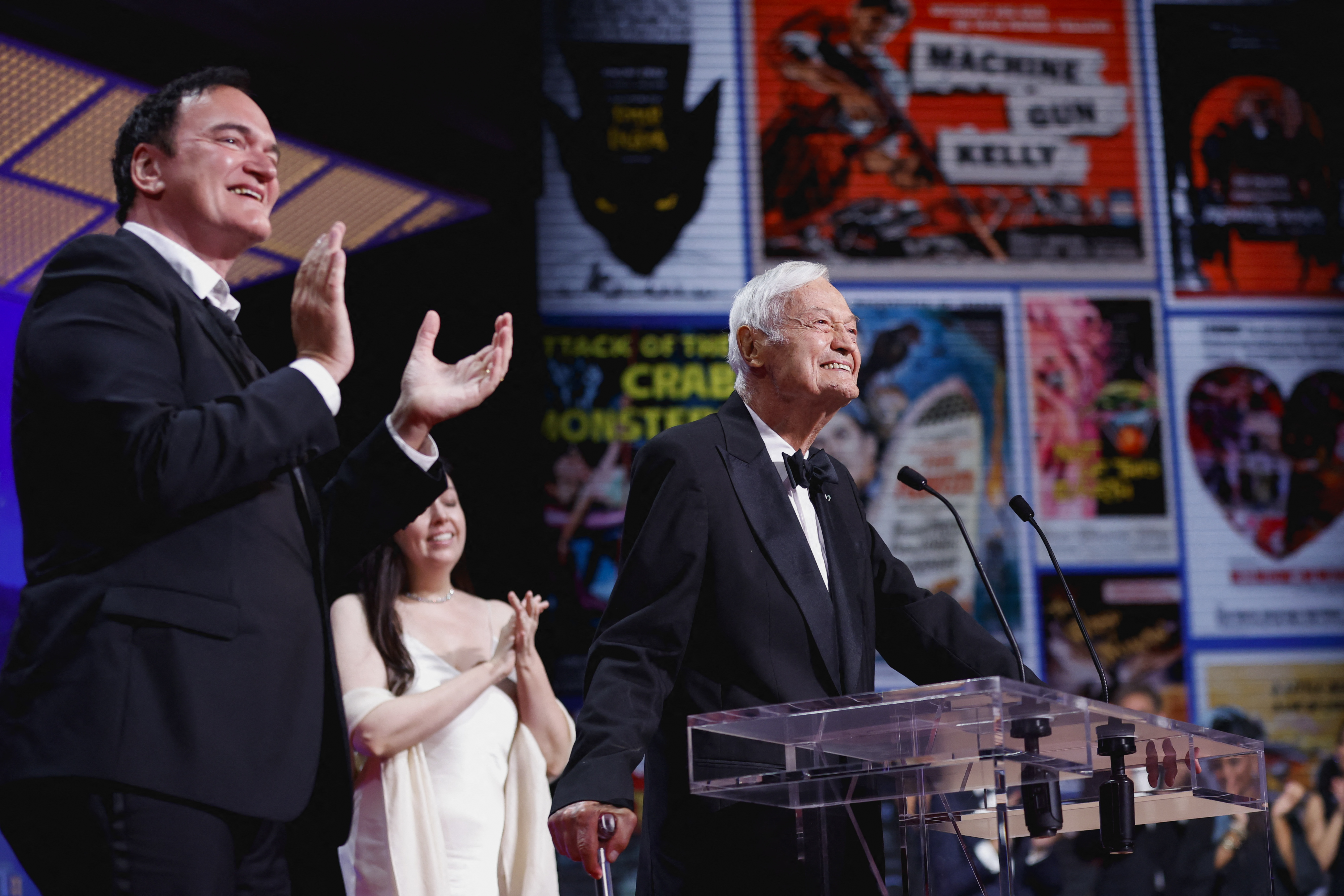 Director Quentin Tarantino applauds filmmaker Roger Corman during the closing ceremony of the 76th Cannes Film Festival in Cannes, France, May 27, 2023. Photo via REUTERS/Gonzalo Fuentes