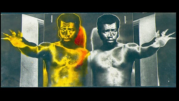 A '70s photo shows a mirror image of artist Ben Caldwall shirtless with his arms extended