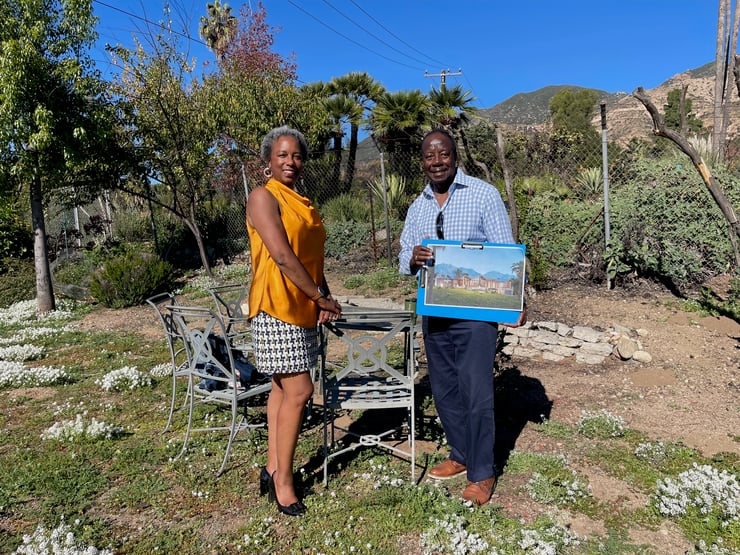 Charles and Lynnelle Bryant show rendering of their replacement house; Photo by Frances Anderton, Dec 2025, IMG_5091