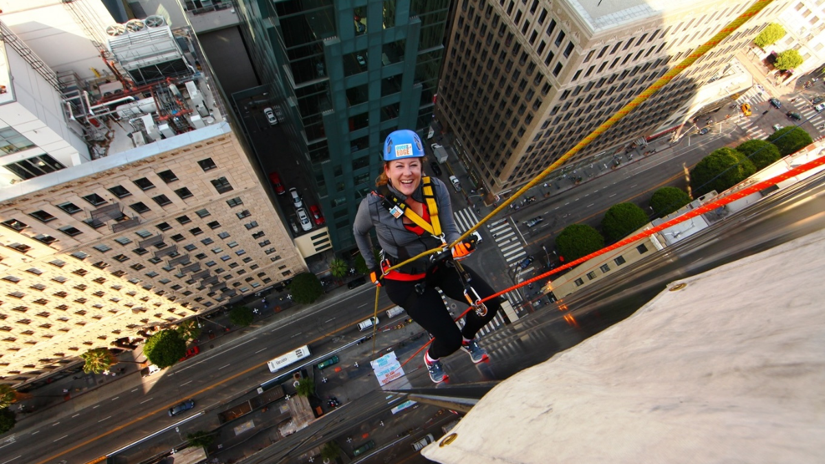 Clare de Briere abseis down the side of the Sheraton Hotel at The Bloc. Image courtesy Clare De Briere.