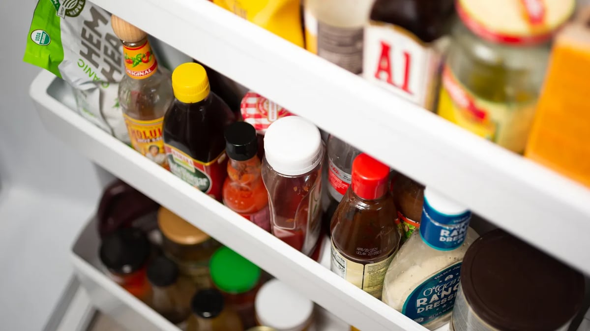 Condiments on the refrigerator door, like mustard and jams, can be used in unexpected ways to make the perfect salad dressing. Photo courtesy of Shutterstock.-1