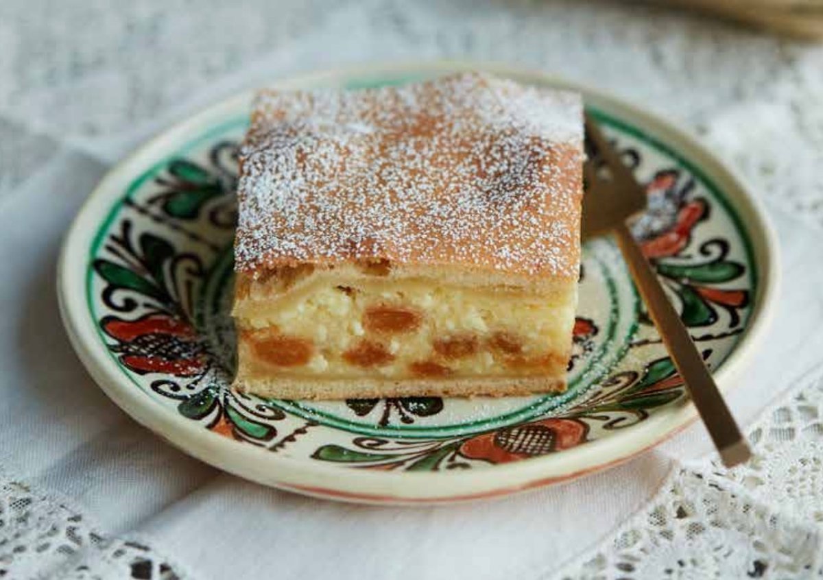 Apples and sultanas (golden raisins) are added to a cheese curd plăcintă, or pie, to give texture to this Romanian dessert. Photo by Matt Russell.