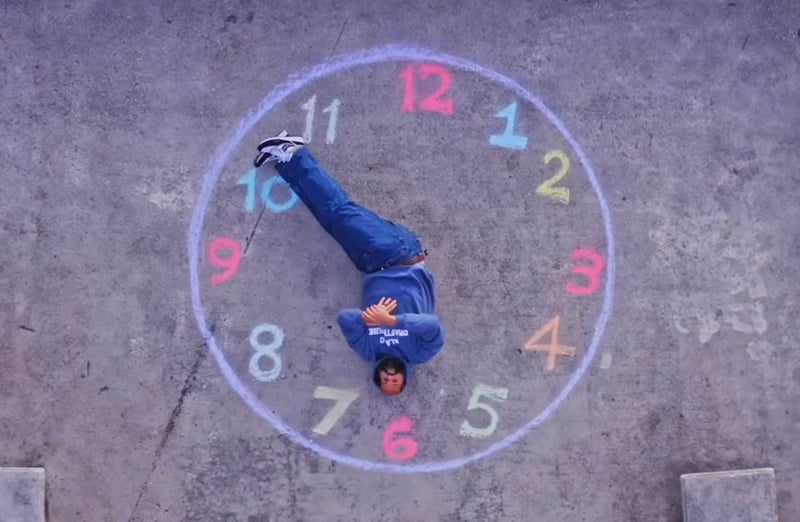 Homeboy Sandman upside down on clock