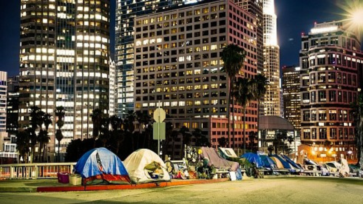 Homeless encampments line a street by the freeway in downtown Los Angeles. Mayor Eric Garcetti’s spending plan for the next fiscal year includes nearly $1 billion to fight homelessness. Photo by Getty Images.