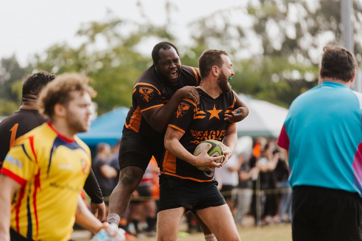 Two Rebellion rugby players celebrate after scoring. Credit: Andrew Thill Photography.