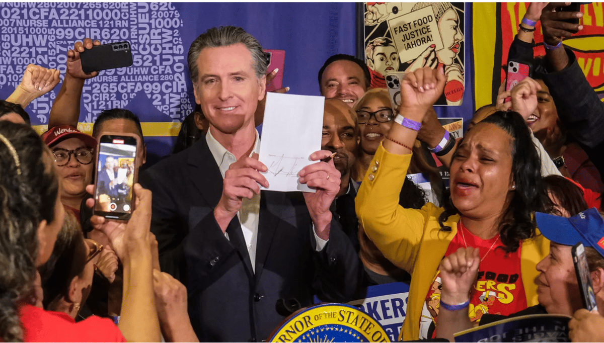 Governor Gavin Newsom signs the fast food bill AB1228 in Los Angeles, on Thursday, Sept. 28, 2023. Starting in April, California's fast food workers will have a minimum wage of $20 per hour under a new law. Photo courtesy of Shutterstock.