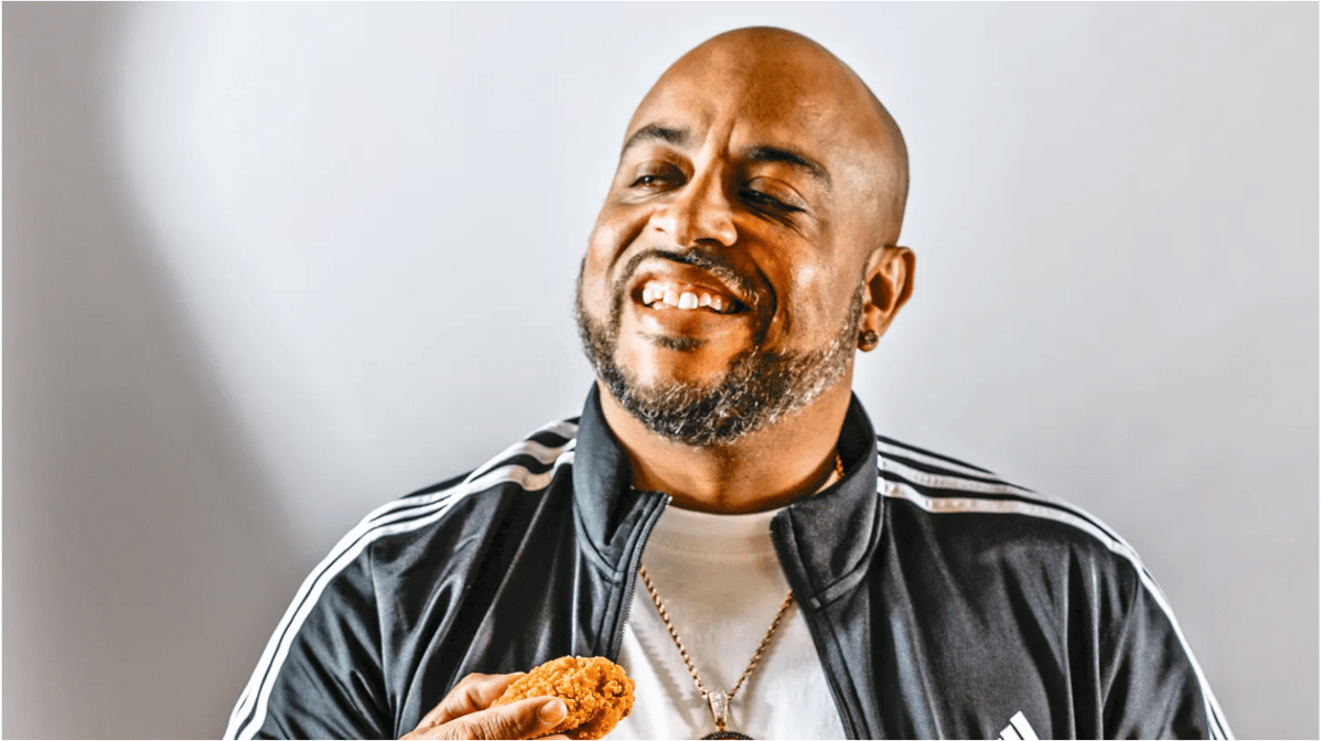 Toriano Gordon enjoys a piece of his vegan fried chicken, which he makes with plant-based Better Chew Shredded Chicken and plenty of seasoning. Photo by Ed Anderson.