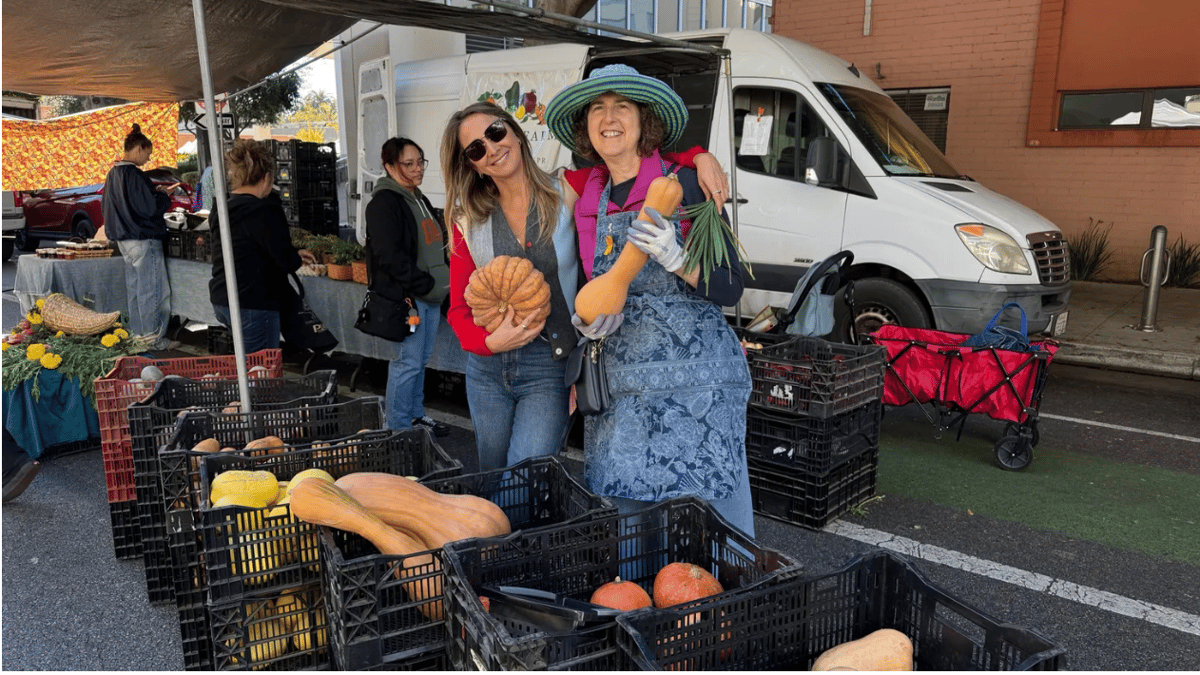 Chef and producer Courtney Storer (left) and Adina Rimmon of Schaner Farms provide cooking inspiration with a variety of squash. Photo by Gillian Ferguson/KCRW