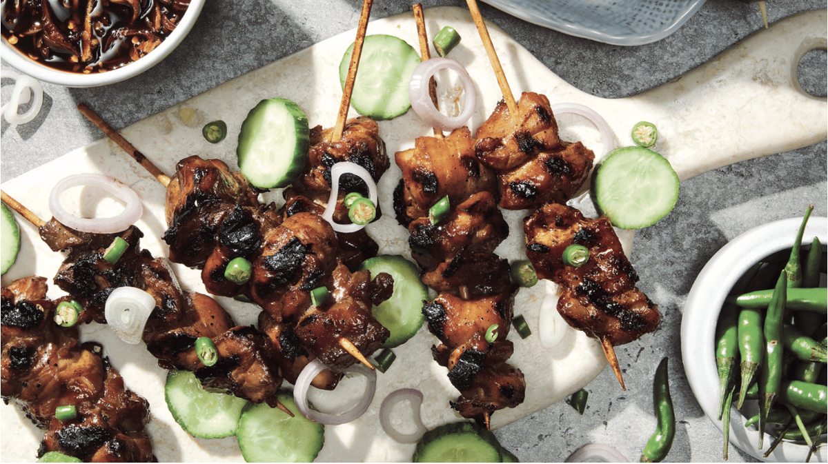 Sate ayam, chicken satay, is a popular street food in Indonesia and typically served with a sauce. Photo by Waterbury Publications Inc.