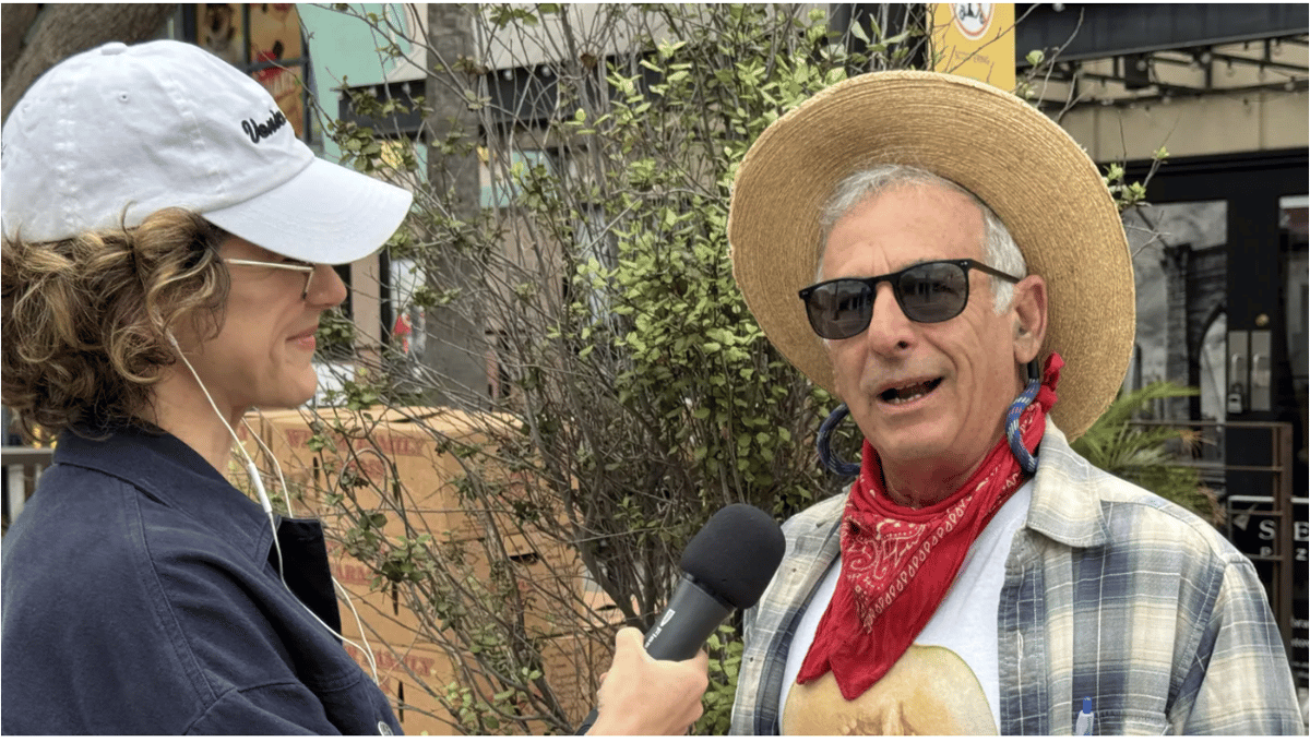 Gillian Ferguson, Good Food's Market Report correspondent, interviews farmer Alex Weiser about melons. Photo by Laryl Garcia/KCRW