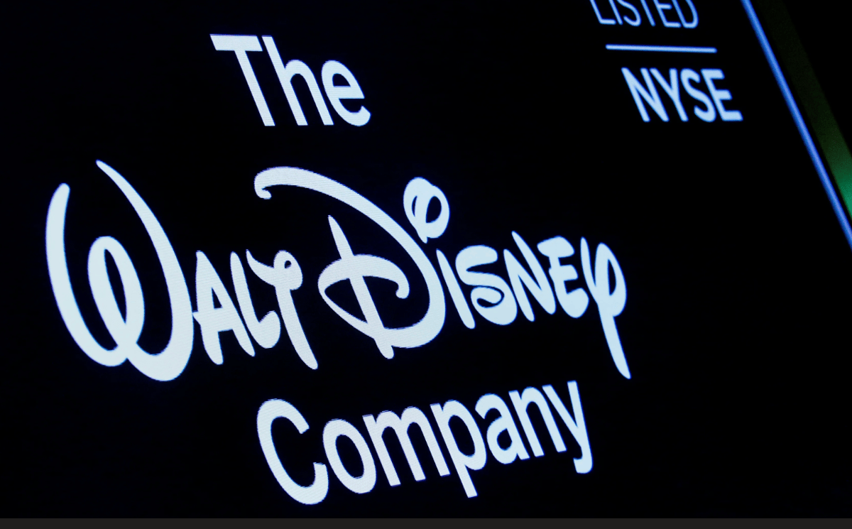 A screen shows the logo and a ticker symbol for The Walt Disney Company on the floor of the New York Stock Exchange (NYSE) in New York, on December 14, 2017. Photo by Brendan McDermid/REUTERS.