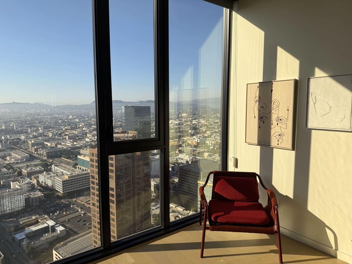 The Beaudry, red chair by window