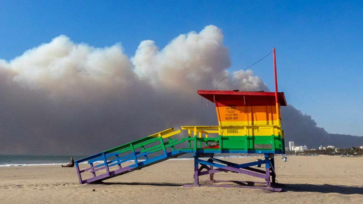 Santa Monica Beach, with Palisades Fire in view; photo by Art Gray