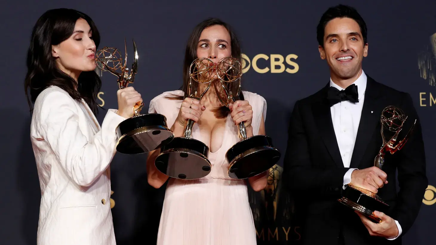 Hacks creators and showrunners Lucia Aniello (center), Paul W. Downs (right), and Jen Statsky (left) pose with their Emmy awards for the series in 2021. Photo credit: Mario Anzuoni/Reuters