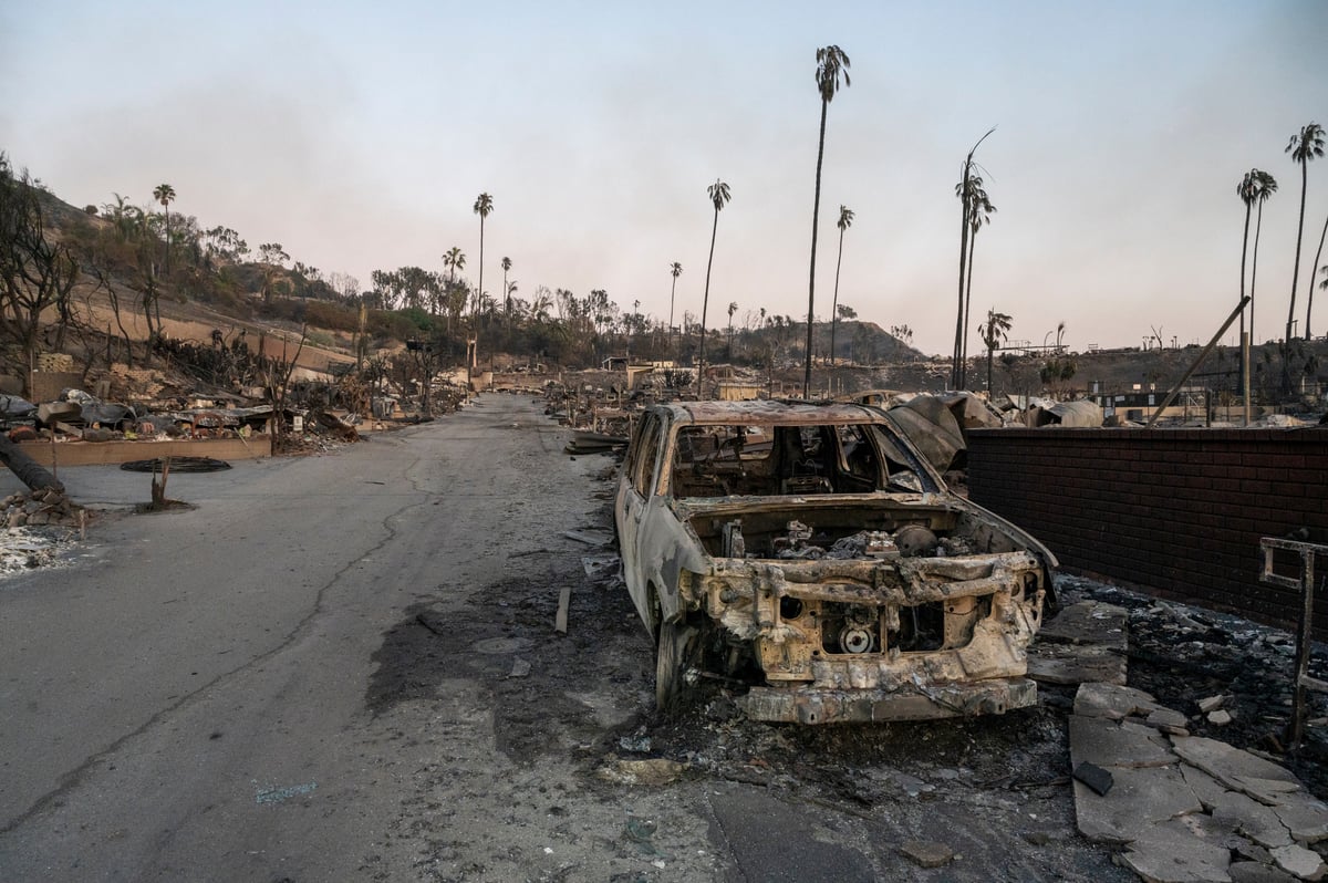 A scorched car sits in a Temescal Canyon mobile home park after the neighborhood was leveled by the Palisades Fire, January 11, 2025. Credit: Shutterstock.