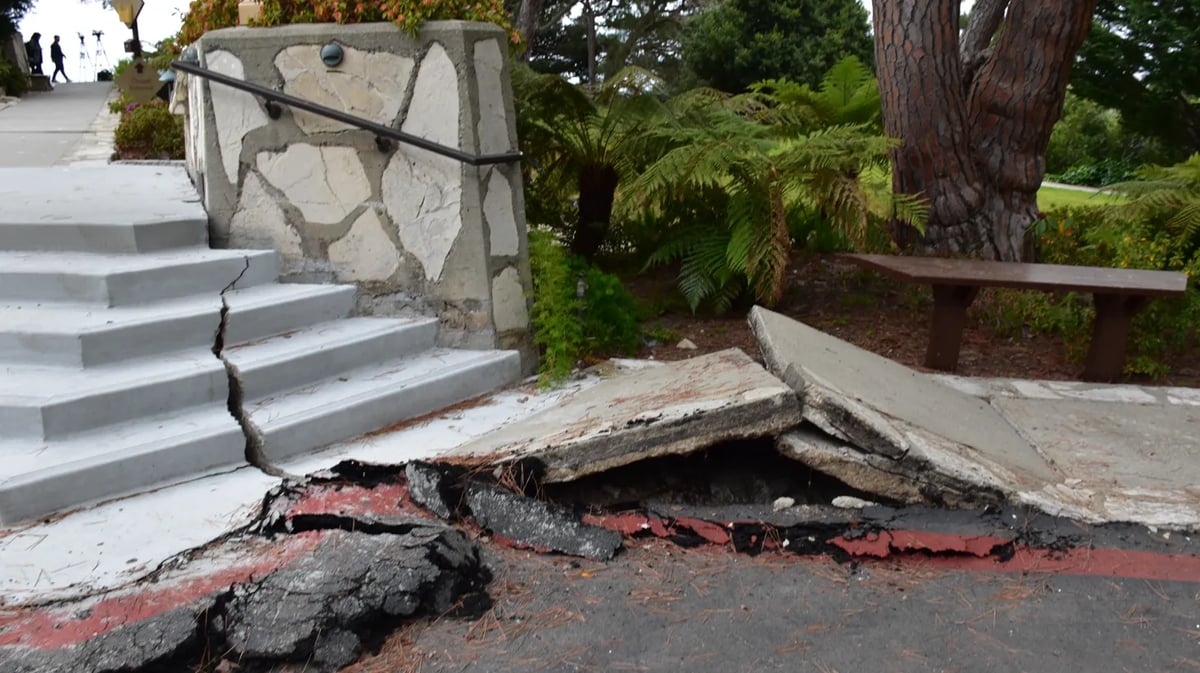 A sidewalk and steps at Wayfarers Chapel in Rancho Palos Verdes buckles from land movement. The concrete steps are relatively new. Photo by Susan Valot.